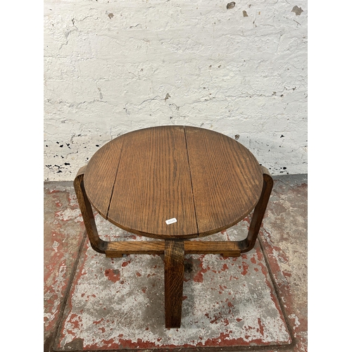 212 - An Art Deco oak side table - approx. 43cm high x 52cm diameter