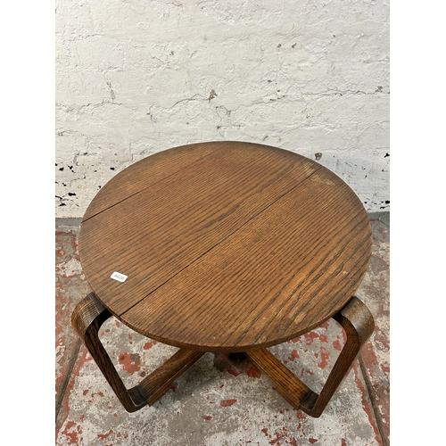 212 - An Art Deco oak side table - approx. 43cm high x 52cm diameter