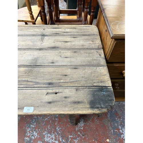 214 - An early 20th century pine trestle table - approx. 75cm high x 61cm wide x 243cm long