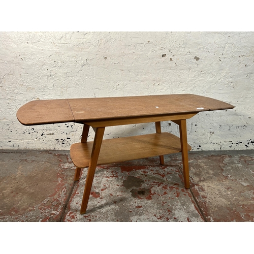 216 - A mid 20th century oak and beech drop leaf coffee table