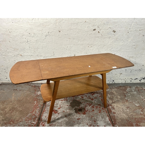 216 - A mid 20th century oak and beech drop leaf coffee table