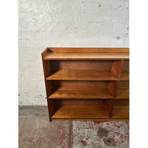 218 - A mid 20th century teak bookcase - approx. 90cm high x 152cm wide x 22cm deep