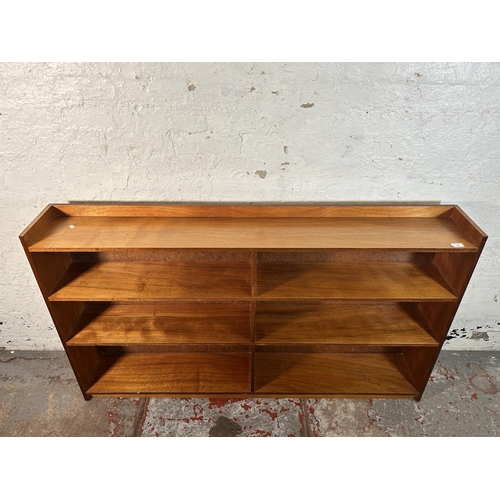 218 - A mid 20th century teak bookcase - approx. 90cm high x 152cm wide x 22cm deep