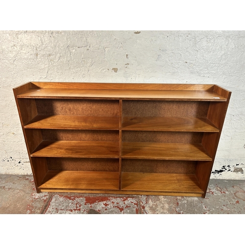 219 - A mid 20th century teak bookcase - approx. 90cm high x 152cm wide x 22cm deep