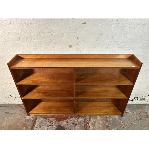 219 - A mid 20th century teak bookcase - approx. 90cm high x 152cm wide x 22cm deep