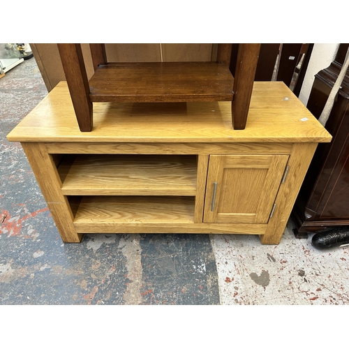 221 - Two pieces of modern furniture, one hardwood side table and one oak TV stand - approx. 51cm high x 9... 