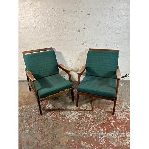 233 - A pair of mid 20th century beech and green fabric upholstered armchairs