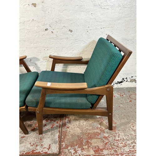 233 - A pair of mid 20th century beech and green fabric upholstered armchairs