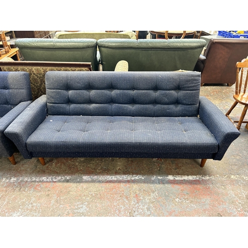 235 - A mid 20th century blue fabric upholstered three piece lounge suite