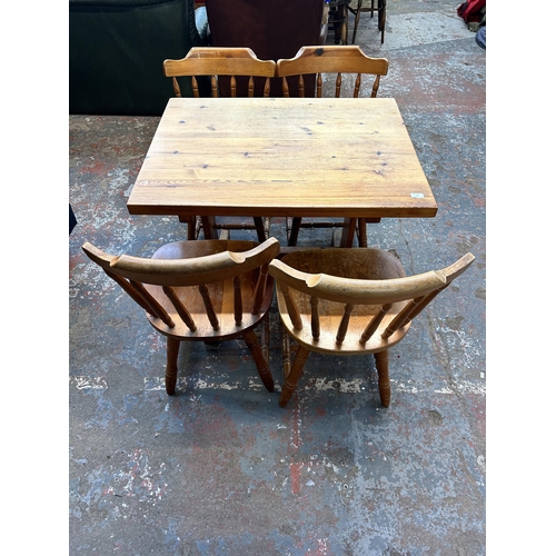 236 - A pine dining table and four chairs - approx. 76cm high x 71cm wide x 91cm long