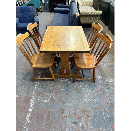 236 - A pine dining table and four chairs - approx. 76cm high x 71cm wide x 91cm long