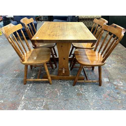 236 - A pine dining table and four chairs - approx. 76cm high x 71cm wide x 91cm long