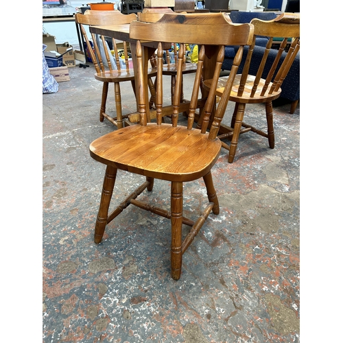 236 - A pine dining table and four chairs - approx. 76cm high x 71cm wide x 91cm long