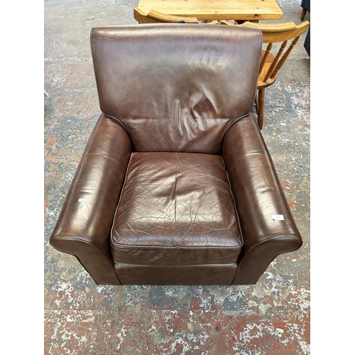 238 - A Marks & Spencer brown leather armchair