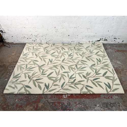 240 - A Laura Ashley 100% wool rug - approx. 200cm x 144cm