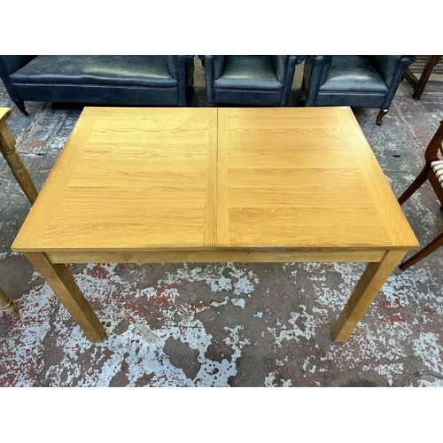 248 - A modern oak and beech rectangular extending dining table approx. 74cm high x 81cm wide x 120cm long