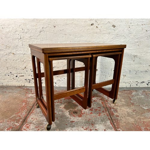 172 - A McIntosh Triform teak nest of tables - approx. 60cm high x 74cm wide x 40cm deep