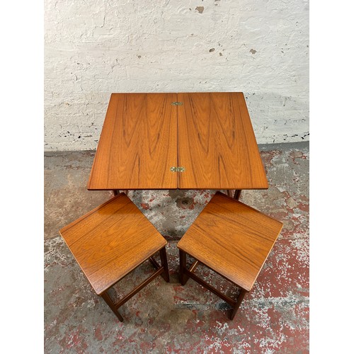 172 - A McIntosh Triform teak nest of tables - approx. 60cm high x 74cm wide x 40cm deep