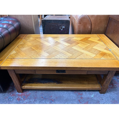 182 - A modern hardwood parquetry inlaid rectangular two tier coffee table - approx. 46cm high x 75cm wide... 