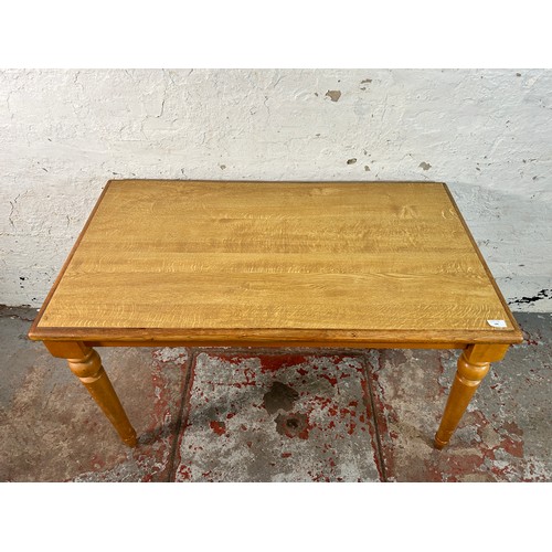 186 - A modern oak effect and beech rectangular kitchen table - approx. 74cm high x 64cm wide x 112cm long