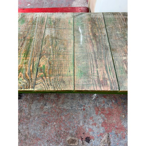 203 - A reclaimed pine and cast iron rectangular coffee table - approx. 46cm high x 61cm wide x 120cm long