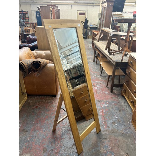 206 - A modern oak framed bevelled edge cheval mirror - approx. 144cm high x 48cm wide