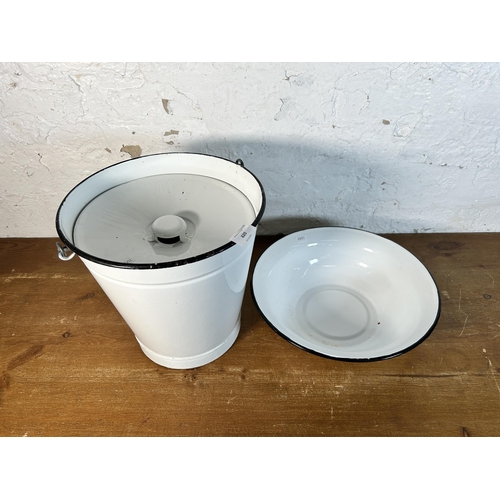 620 - Two mid 20th century white enamel items, one sloped milk pail and one bowl