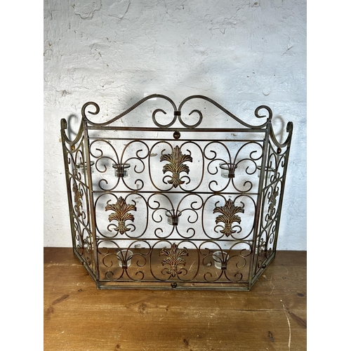 625 - A cast metal fire screen with glass tea light holders to reverse - approx. 73cm high