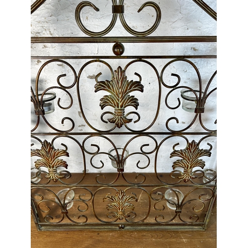 625 - A cast metal fire screen with glass tea light holders to reverse - approx. 73cm high