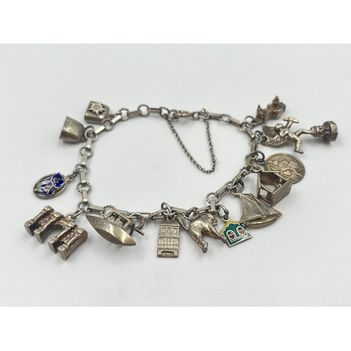 2001 - A silver charm bracelet with assorted charms - approx. gross weight 22.2g