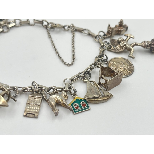 2001 - A silver charm bracelet with assorted charms - approx. gross weight 22.2g