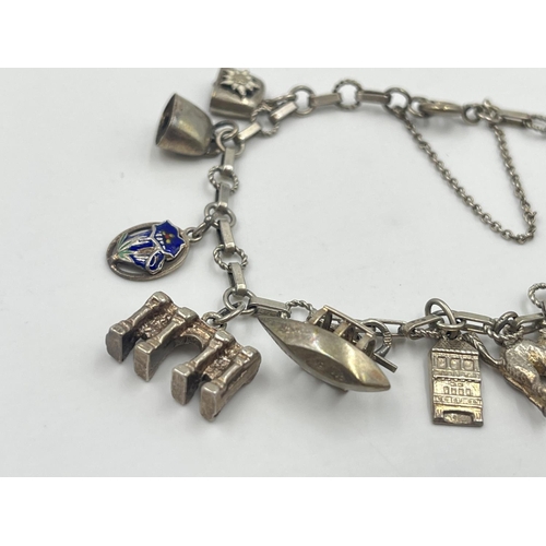 2001 - A silver charm bracelet with assorted charms - approx. gross weight 22.2g