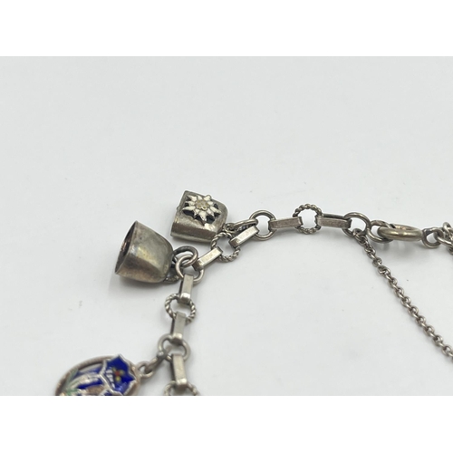 2001 - A silver charm bracelet with assorted charms - approx. gross weight 22.2g