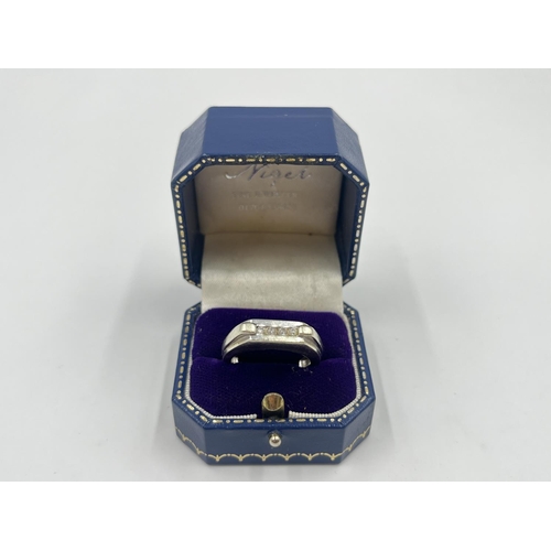 2009 - A hallmarked Birmingham 9ct white gold diamond four stone ring, size T - approx. gross weight 9.5g