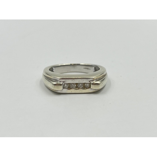 2009 - A hallmarked Birmingham 9ct white gold diamond four stone ring, size T - approx. gross weight 9.5g