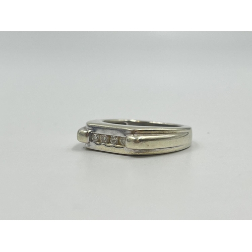 2009 - A hallmarked Birmingham 9ct white gold diamond four stone ring, size T - approx. gross weight 9.5g