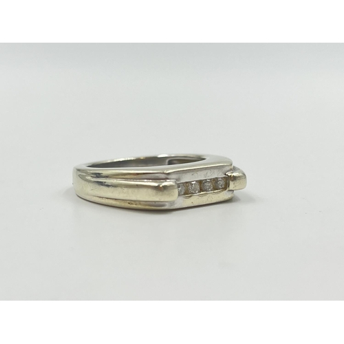 2009 - A hallmarked Birmingham 9ct white gold diamond four stone ring, size T - approx. gross weight 9.5g