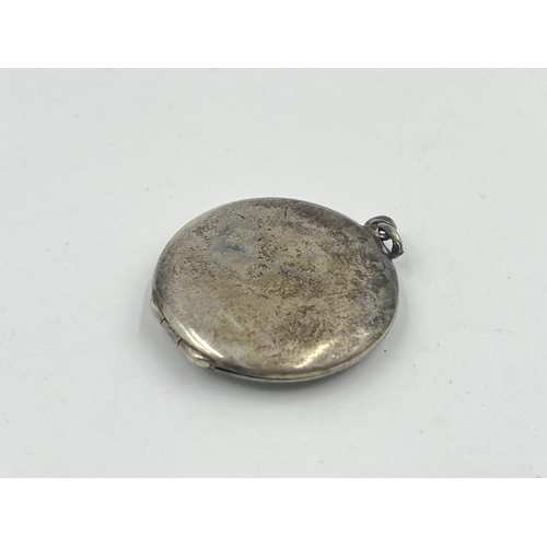 2016 - A .935 silver and guilloche enamel photo locket - approx. gross weight 8g and 3cm diameter