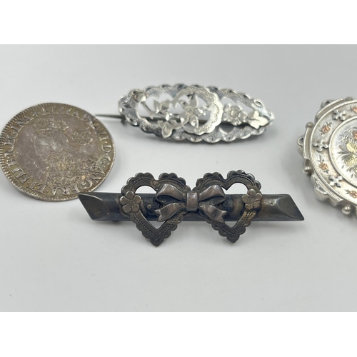 2017 - Four antique silver brooches, three hallmarked sterling silver and one .925 1562 sixpence - approx. ... 