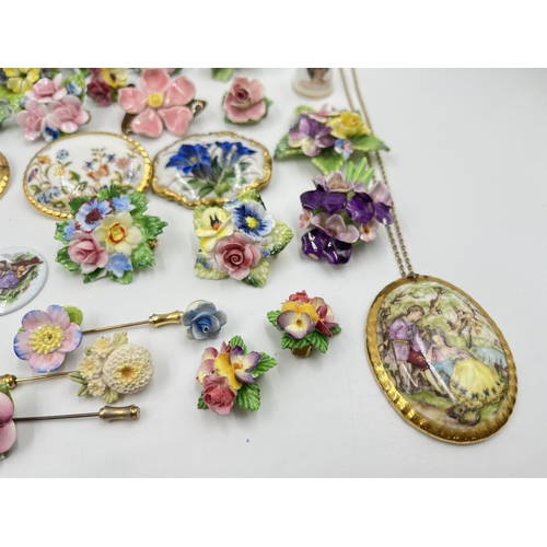 2018 - A collection of ceramic brooches and pendants to include Wedgwood black Jasperware, Aynsley Orchard ... 