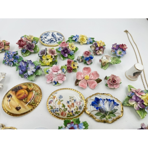 2018 - A collection of ceramic brooches and pendants to include Wedgwood black Jasperware, Aynsley Orchard ... 