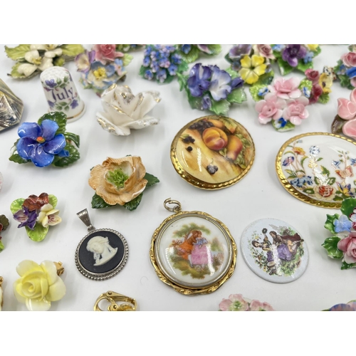 2018 - A collection of ceramic brooches and pendants to include Wedgwood black Jasperware, Aynsley Orchard ... 