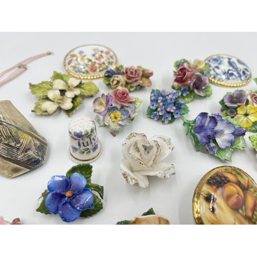 2018 - A collection of ceramic brooches and pendants to include Wedgwood black Jasperware, Aynsley Orchard ... 