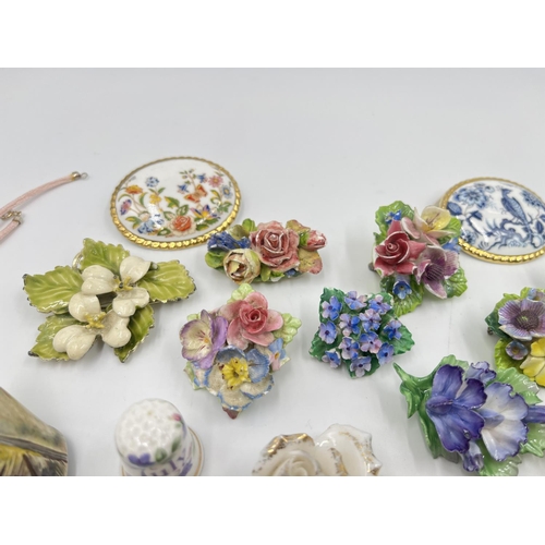 2018 - A collection of ceramic brooches and pendants to include Wedgwood black Jasperware, Aynsley Orchard ... 