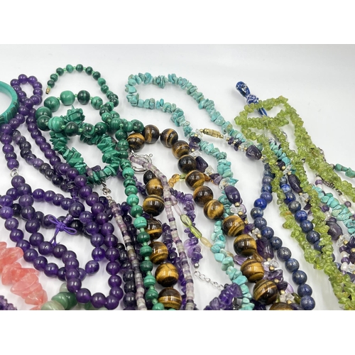 2022 - A collection of gemstone jewellery to include tiger's eye, amethyst, rose quartz etc.