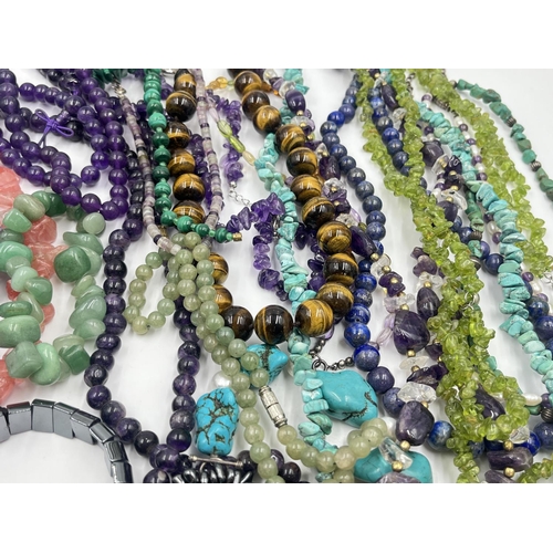 2022 - A collection of gemstone jewellery to include tiger's eye, amethyst, rose quartz etc.