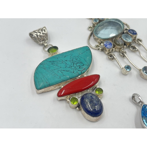 2044 - A collection of .925 silver pendants to include peridot, turquoise, coral and lapis lazuli etc.