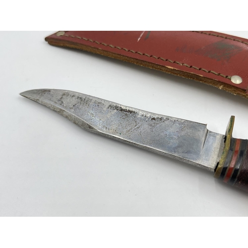 2216 - A vintage William Rodgers hunting knife with leather sheath - approx. 20.5cm long