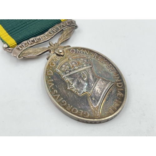 2312 - A George VI Territorial Service medal presented to 875643 Sjt. J. Noble R. A.