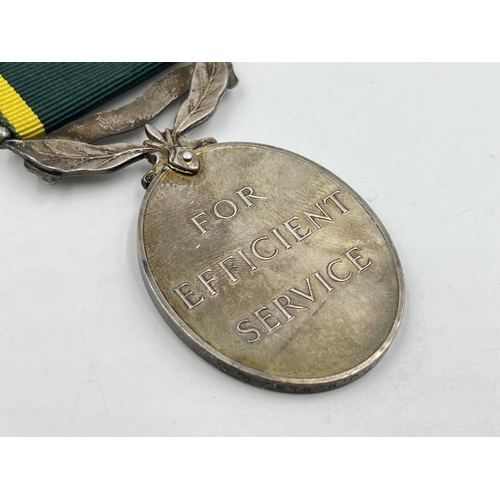 2312 - A George VI Territorial Service medal presented to 875643 Sjt. J. Noble R. A.